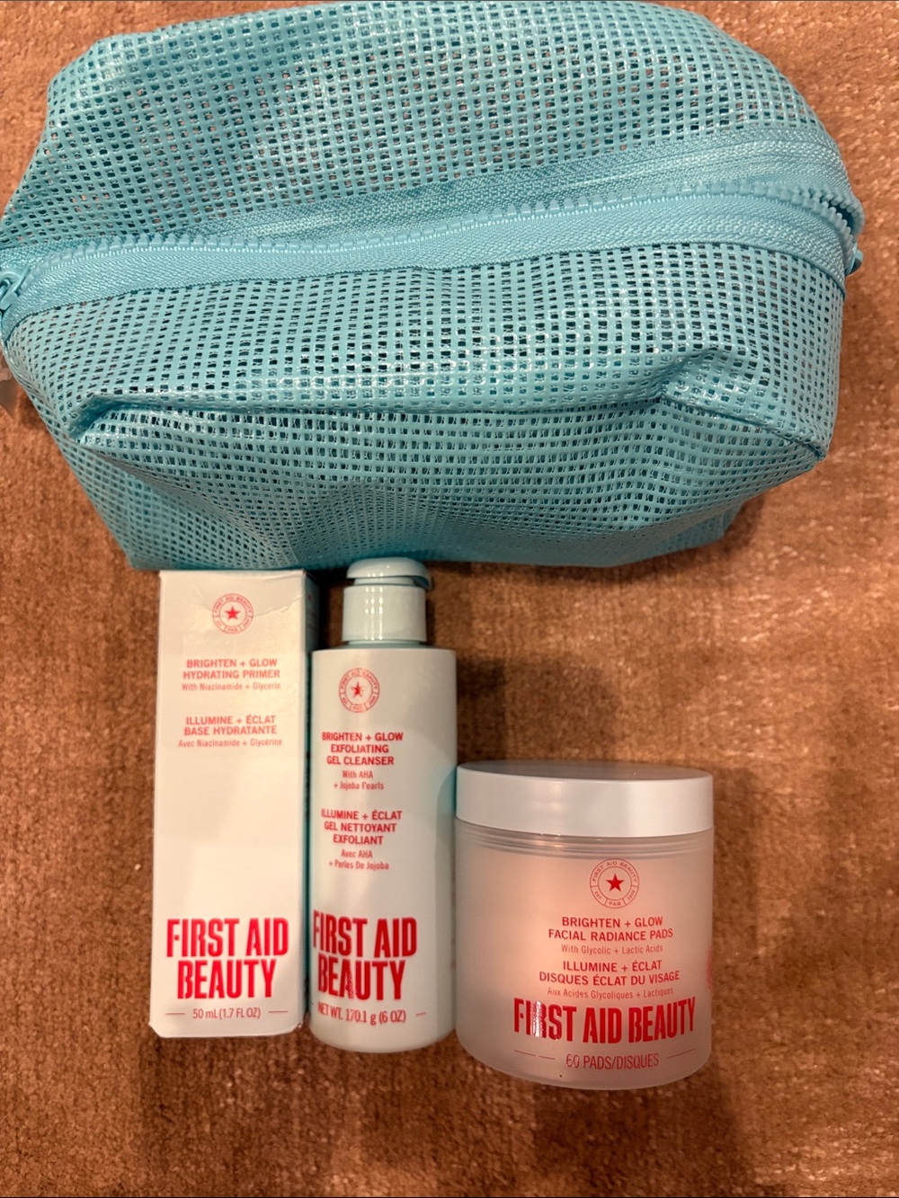 First Aid Beauty Brighten + Glow Set with Aqua Mesh Pouch